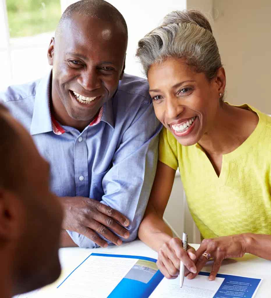 Man and woman discussing term life insurance with someone
