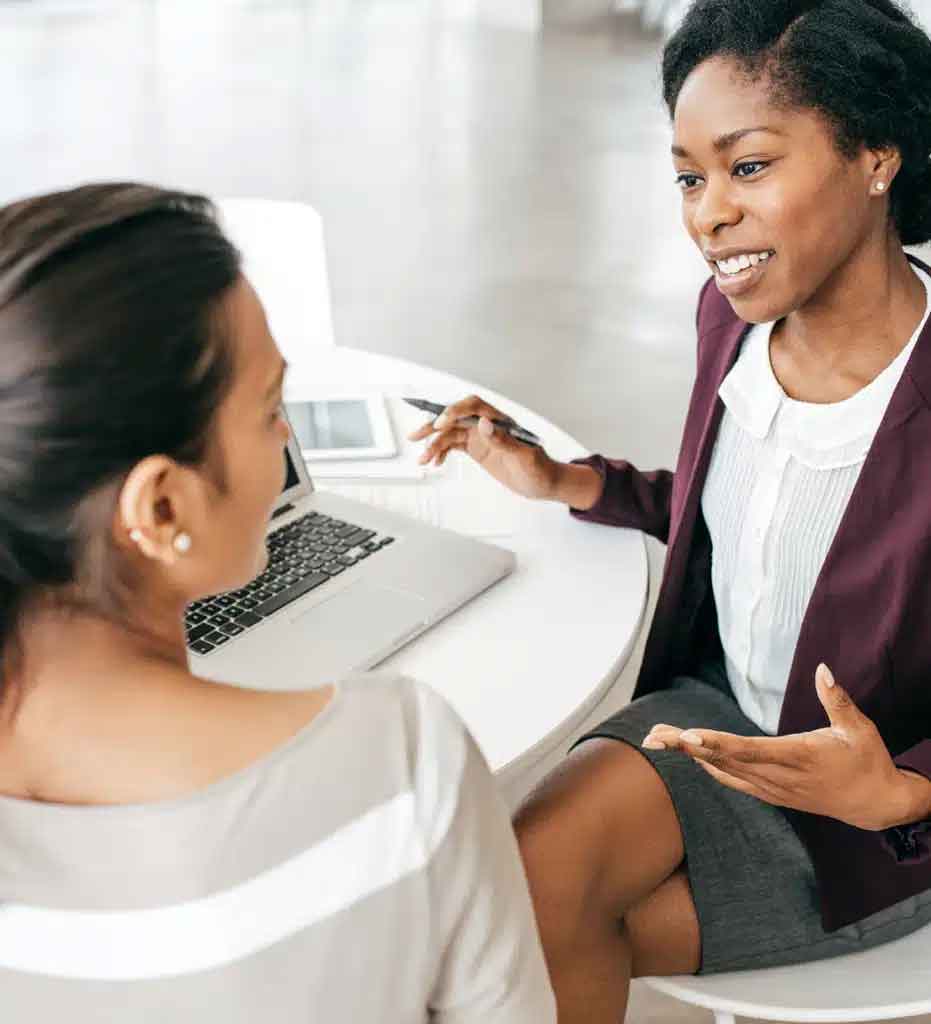 Two women consult on term life insurance