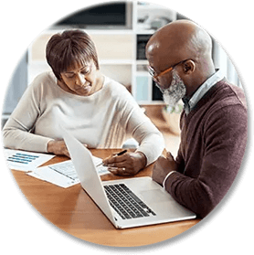 Older couple reviewing papers