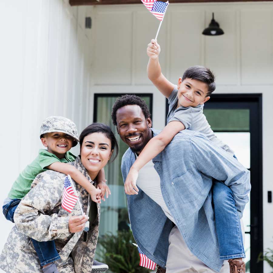Young federal family waving U.S.A. flags